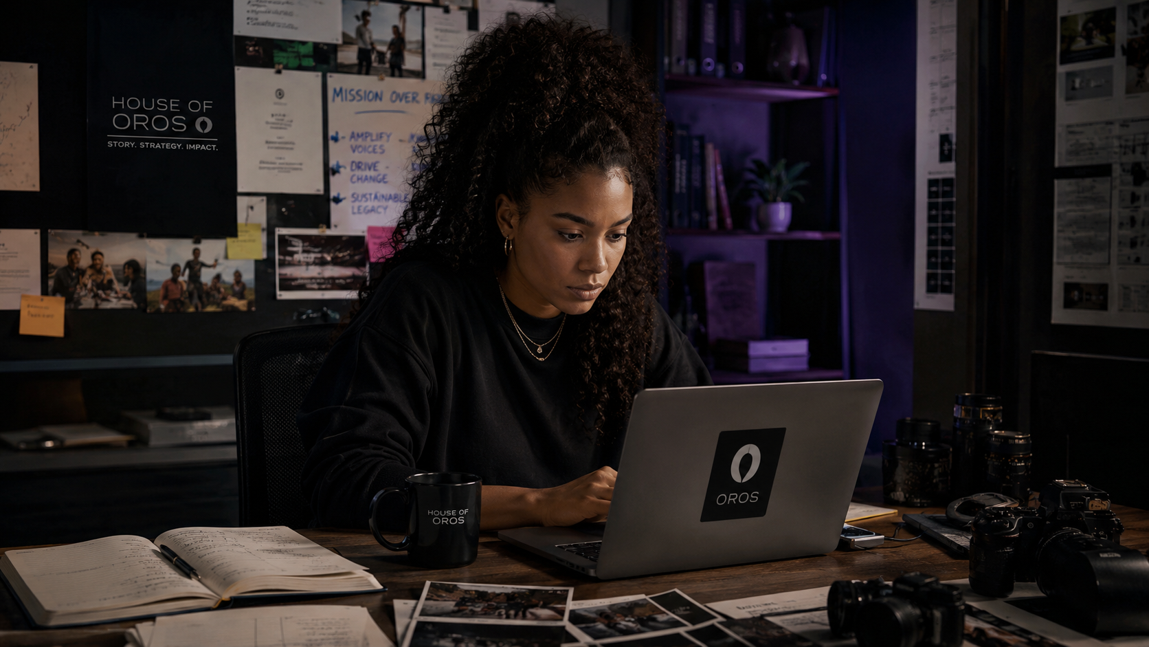 Operator working late at a laptop in a creative studio workspace